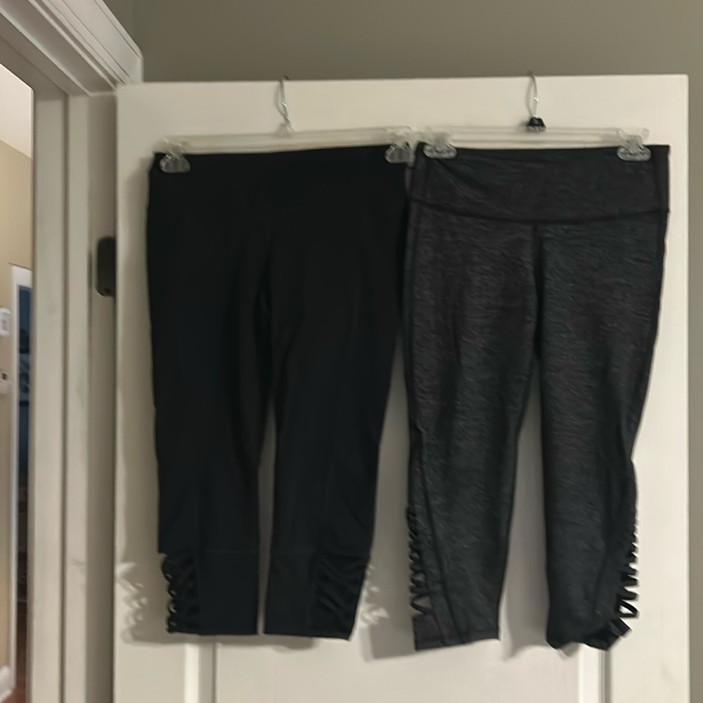 Lot of 2 EUC Athleta capri leggings size small with cute cutout design on leg.